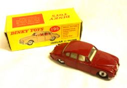 DINKY TOYS NO 195, a very good boxed Maroon Jaguar 3.4 litre Saloon, factory-marked abrasion to roof