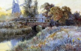 CHARLES HARMONY HARRISON (1842-1902) A NORFOLK WINTER RIVER LANDSCAPE WITH BRIDGE AND MILL