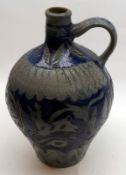 An 18th Century Westerwald Flagon, decorated with incised decoration of deer, stars etc, blue