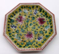 A Chinese Octagonal Plate, the centre painted in underglaze blue, famille verte and rose with