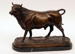 A 20th Century Patinated Bronze Model of a bull, on black marble base, 15” long