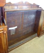 An Oak Bookcase with broken arch pediment over a plain top and fitted below with adjustable