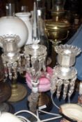 A mid-20th Century Baccarat Clear Glass Two Branch Candelabrum, with central removable obelisk,