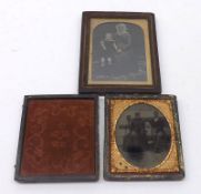 Two Ambrotype Pictures, one oval depicting a family group of father, wife and child seated on a