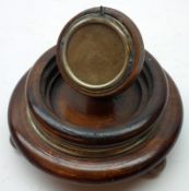 A 19th Century Walnut Pocket Watch Stand of circular form, with central pedestal and hinged rim (