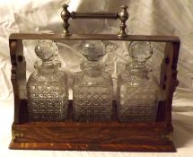 An early 20th Century Oak Silver Plated Mounted Tantalus, the top embossed “Royal Albert Yacht Club,