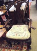 A Mahogany Queen Anne style Carver Chair with vase-shaped splat back, slightly splayed arms and