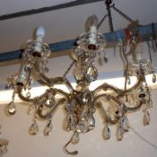 A 20th Century eight branch Chandelier with clear glass prismatic drapes