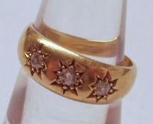 An Edwardian hallmarked 18ct Gold three small Old Cut Diamond Ring, in gypsy style, hallmarked for