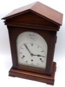 A Mahogany Cased Mantel Clock, the architectural case with arched pediment to a single glazed door