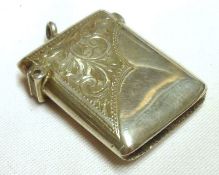 An Edward VII Vesta Case of typical hinged form decorated with chased floral decoration,