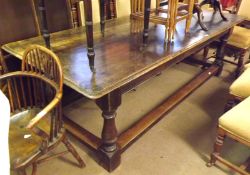 A large Victorian Rectangular Oak Refectory style Dining Table, of heavy turned legs and stretchers,