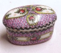 An unusual late 19th Century Oval Miniature Pill Box, decorated with coloured floral sprays, printed