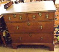 An 18th Century Oak Chest, plain top with moulded edge, two short and two full width graduated