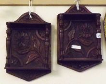 A pair of probably composite Carved Oak Wall Brackets, each fitted with two open shelves joined by