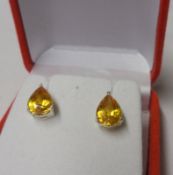 A pair of white metal and Yellow Sapphire Teardrop design Stud Earrings, 10mm x 7mm maximum, stamped