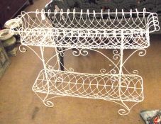 A white painted wirework Two Tier Planter of rectangular form, raised on scroll feet, circa late