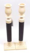 A pair of Ivory Mounted Candlesticks, campana shaped sconces and stepped spreading square bases,