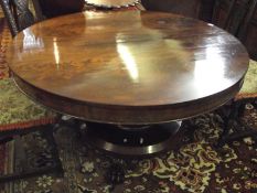 A William IV period Mahogany Circular Pedestal Dining Table, with plain top and frieze and raised on