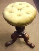 A Victorian Mahogany Circular Adjustable Piano Stool with balustered support terminating in a tripod