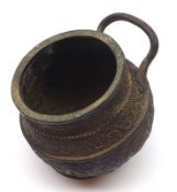 An Oriental Single-handled Angled Balustered Spice Pot, embossed with twining foliage etc, with