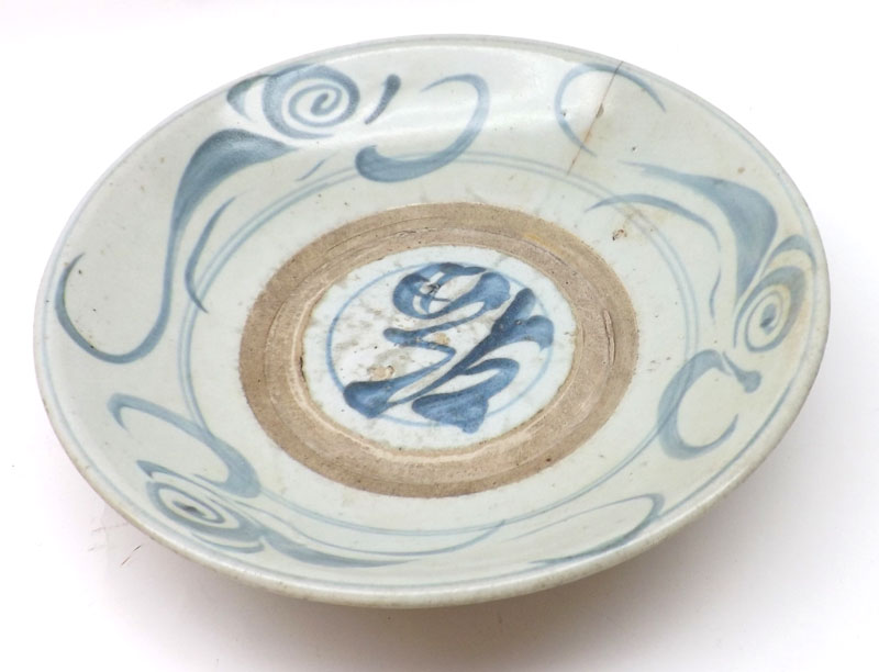 An Oriental Circular Bowl, decorated in underglaze blue with scrolls etc (hairline crack), 12”