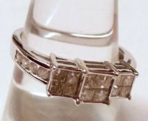 A hallmarked 9ct White Gold Multi Stone, Princess Cut Diamond Ring