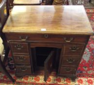 A Mahogany Queen Anne style small Kneehole Desk, moulded edge with boxwood stringing and central