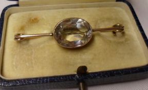 A mid-Victorian 9ct Gold Framed Brooch featuring a large centre oval cut Rock Crystal Stone, 56mm