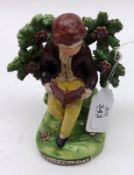 A 19th Century Staffordshire Bocage Back Figure, Reading Boy, decorated in colours, raised on a