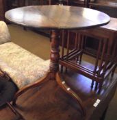 An early 19th Century Round Top Tripod Table on turned column and three spreading legs, 24” wide