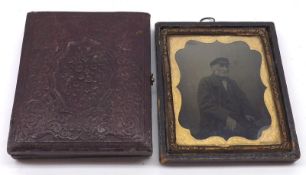 A Daguerreotype Portrait of two young women (one seated) in an embossed morocco case; together