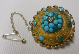 A Victorian Gold Circular Brooch, the raised centre pavé set with Turquoise stones and central small