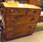 A Victorian Walnut Military Style Chest, of two short and three long drawers with brass cup handles,