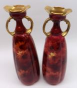 A pair of Doulton Burslem tapering double-handled Vases, decorated with a floral design in