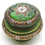 A late 19th/early 20th Century Covered  Green Glass Jar, fitted with hinged lid, raised on a round