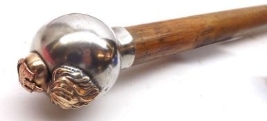 An unusual Walking Cane, chromium or silver plated globular handle applied with a former epaulette