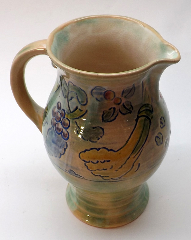 A Royal Doulton Brangwyn designed Jug, decorated with coloured fruit and vegetables on a pale