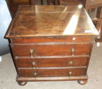 An 18th Century Oak Small Commode Chest with plain top, moulded edge, the front fitted with three