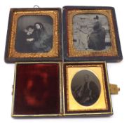 Three Daguerreotype Portraits, one in a folding leather plush-lined case and depicting an old lady