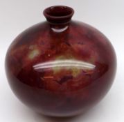 A small Squat Flambé Vase, decorated in a marbled design, 4 ½” high (unmarked to base)