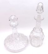A modern flat bottomed Ship’s Decanter with cut detail; together with a further Clear Glass mallet-