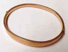 An early 20th Century hallmarked 9ct Gold hollow Bangle, 6 ½ cm x 5 ½ cm, weighing approximately 6