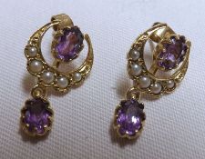 A pair of hallmarked 9ct Gold crescent design Earrings, Seed Pearl set with Amethyst centre and