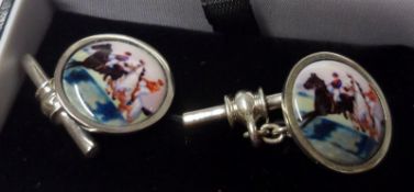 A pair of white metal Enamelled Disc Cufflinks, featuring horse racing scenes, 18mm diameter