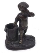 A Bronzed Novelty Vesta Striker modelled as a young child beside a bucket, the base with ribbed