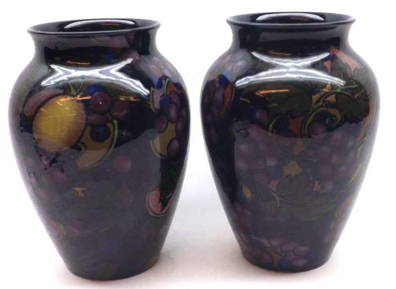 A pair of Royal Stanley Ware Jacobean pattern Vases, decorated with coloured design of fruit on a