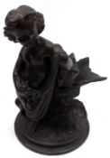 A Bronzed Spelter Model of a child in robes amongst foliage, on a round spreading loaded base, 8”