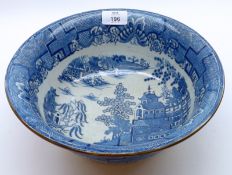 An early Victorian Round Small Wash Bowl, decorated with a blue transferred Willow pattern design,