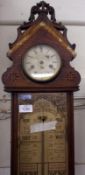 A late 19th Century combination Wall Clock and “Admiral Fitzroy’s Barometer”, the arched case with